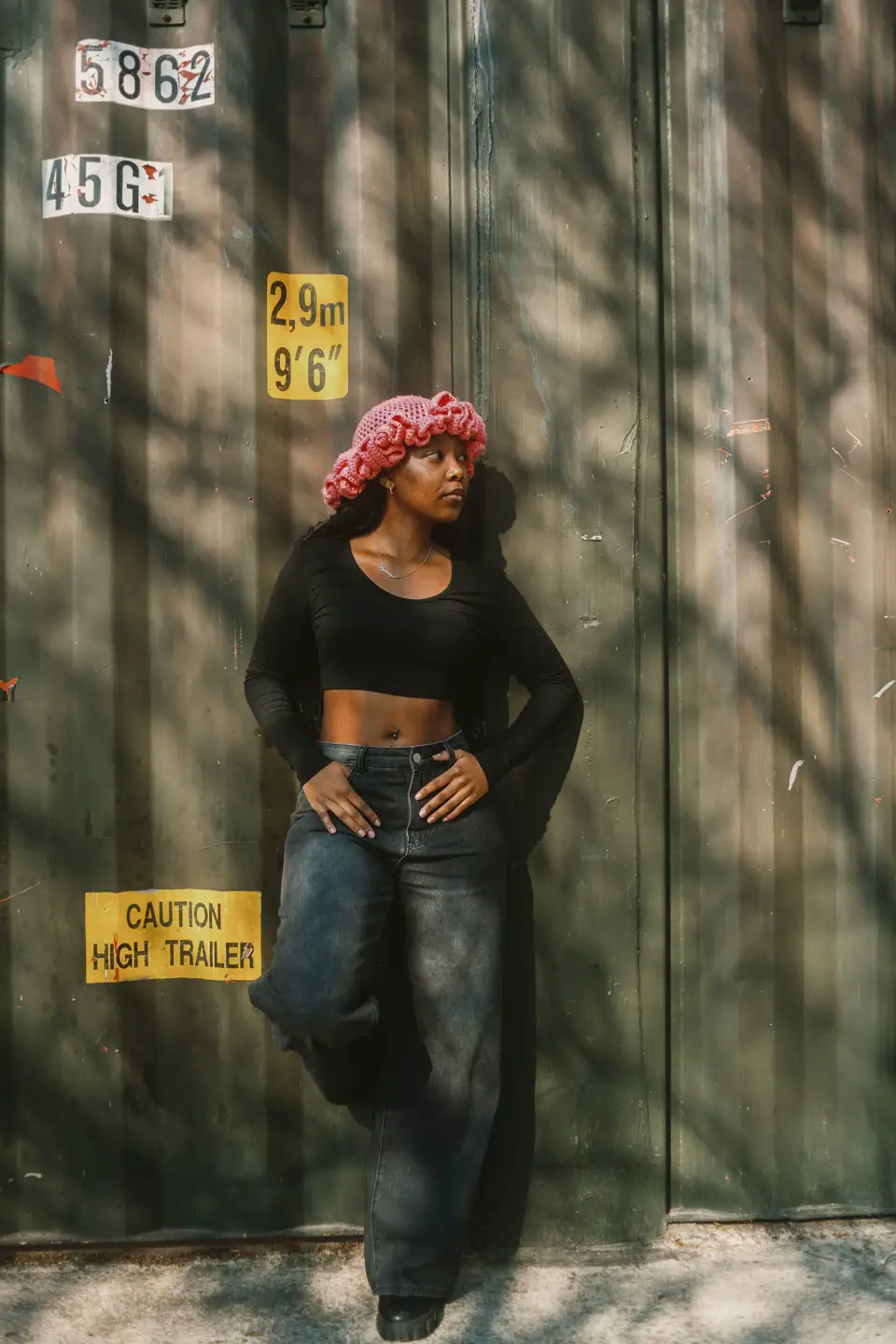 A young woman smiling outdoors in Johannesburg, South Africa.